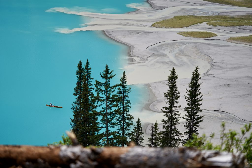 Lake Louise canoe on turquoise water in Banff National Park – Catholic travel story